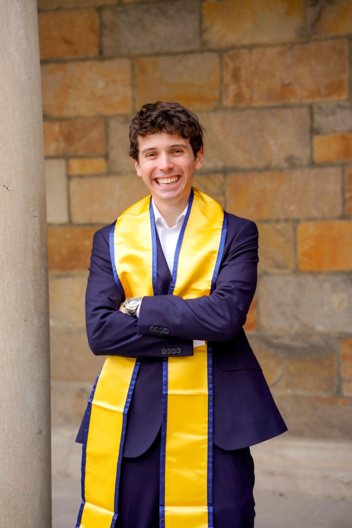 Antonio Colon in University of Michigan graduation regalia